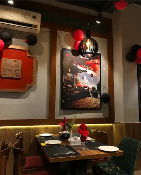 Booth seating beneath framed artwork
